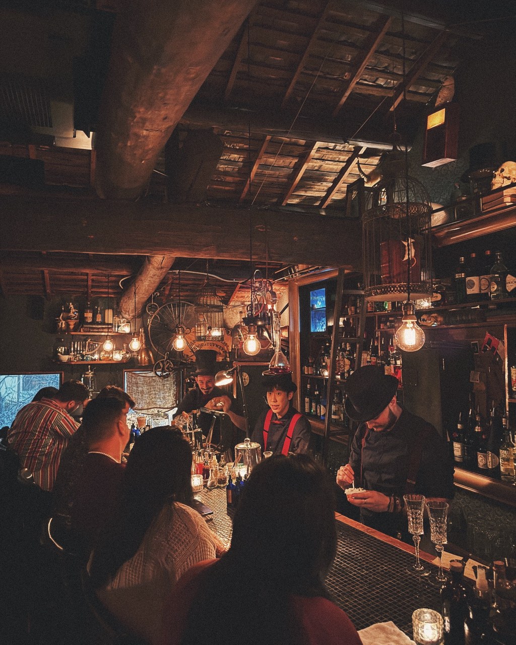 A candlelit, hidden speakeasy in Seoul with bartenders in vintage dress
